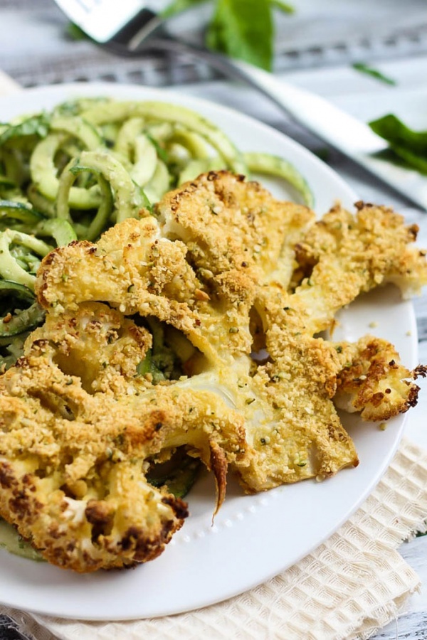 Vegan Parmesan Cauliflower Steaks over Hemp Pesto Zoodles – Emilie Eats