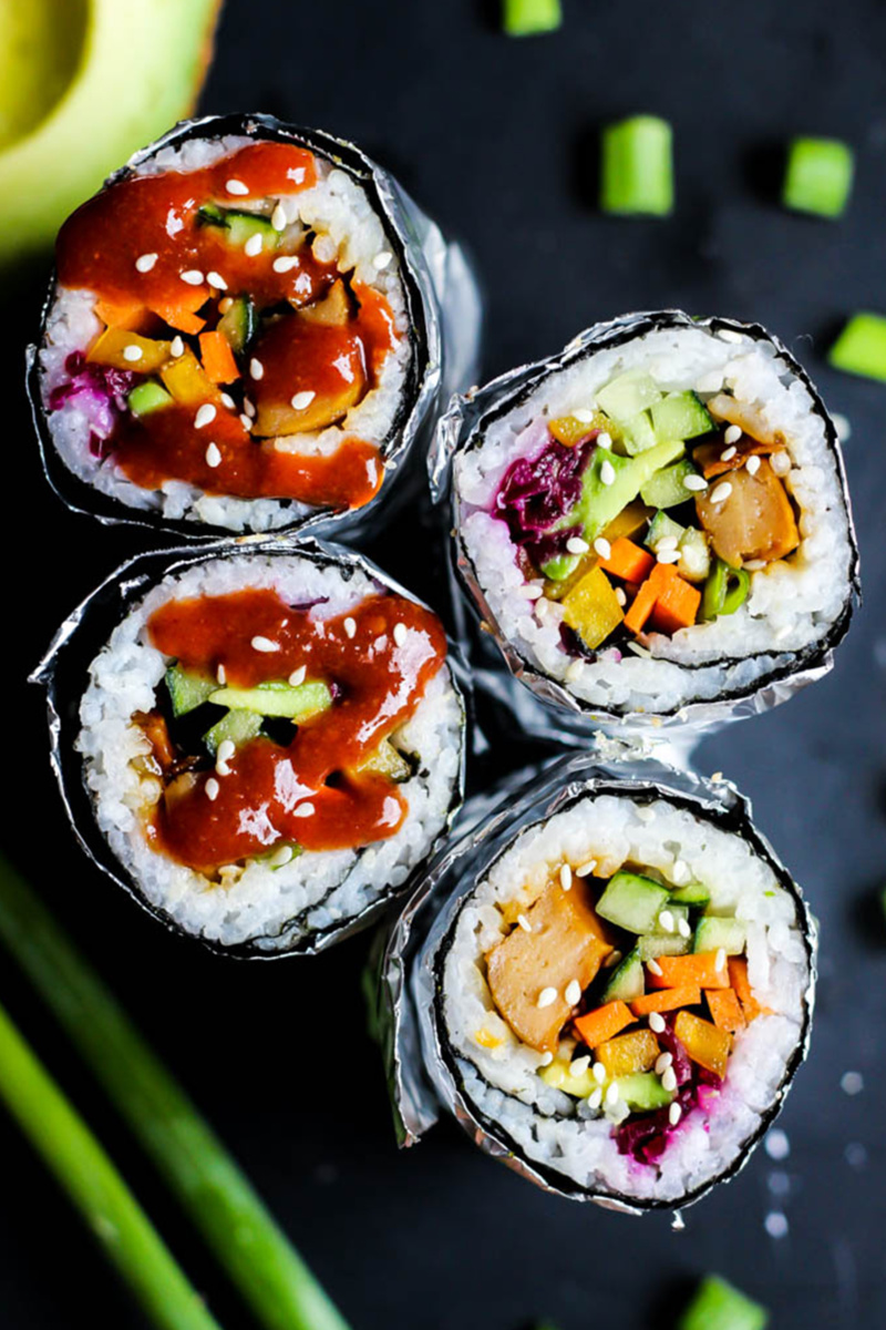 two vegan sushi burritos cut in half