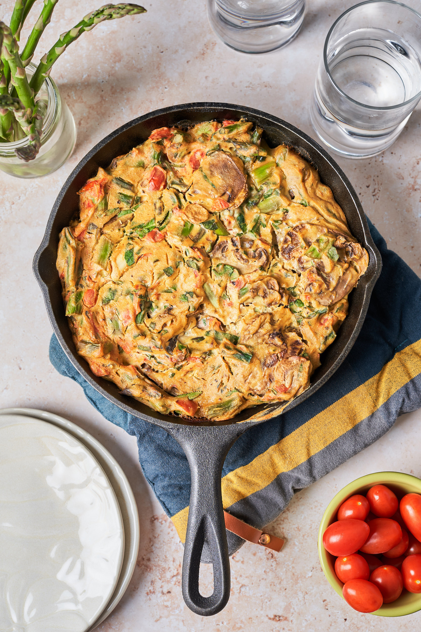 a vegan mushroom quiche baked into a cast iron skillet